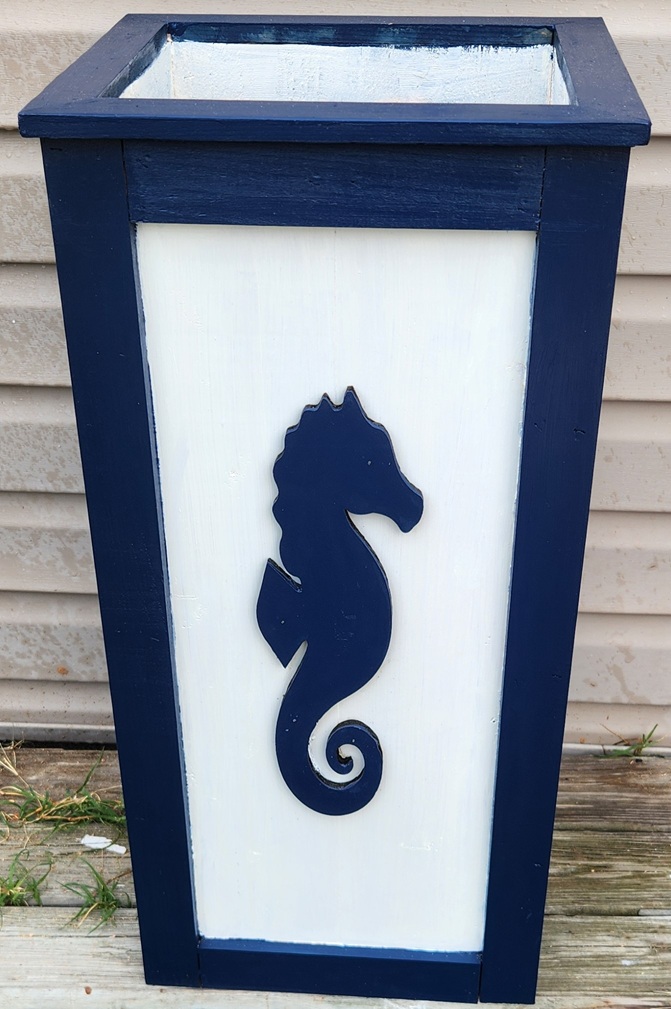Front side of our Seahorse Tall Boy 28.5"H x 14 Square top, Exterior stained and Custom Cutouts attached